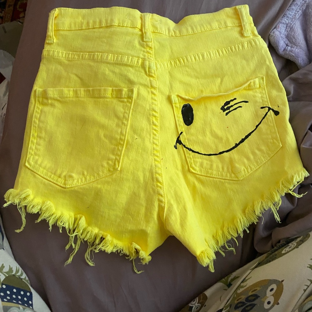 Smiley face yellow jean shorts
